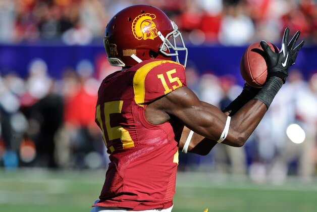 Southern California wide receiver Nelson Agholor (15) makes a touchdown reception against Fresno State in the first quarter of the Royal Purple Bowl NCAA college football game, Saturday, Dec. 21, 2013 in Las Vegas. (AP Photo/David Cleveland)