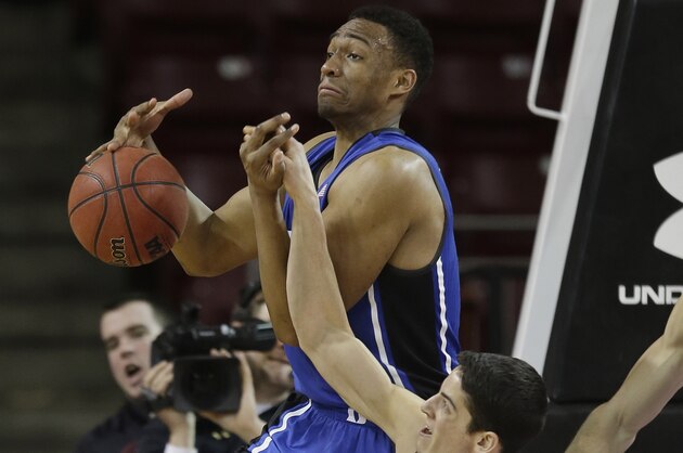 Boston College guard Danny Rubin (31) knocks the ball away from Duke forward Jabari Parker (1) during the second half of their NCAA  college basketball game on the Boston College campus in Boston, Saturday, Feb. 8, 2014. Duke defeated Boston College 89-68. (AP Photo/Stephan Savoia)