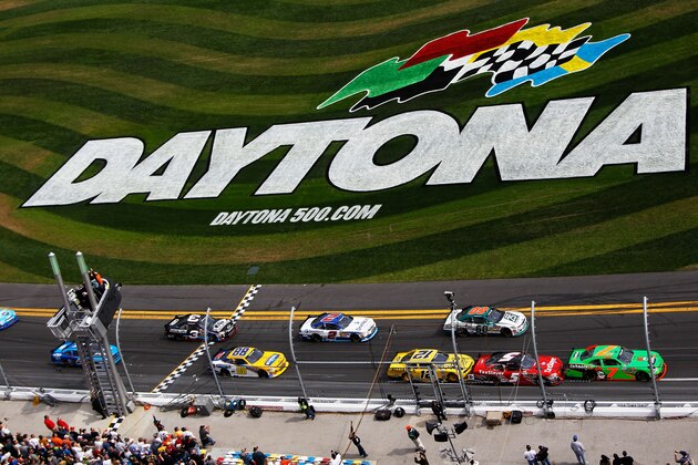 DAYTONA BEACH, FL - FEBRUARY 25:  Danica Patrick, driver of the #7 GoDaddy.com Chevrolet, is drafted by Dale Earnhardt Jr., driver of the #5 TaxSlayer.com Chevrolet, during the NASCAR Nationwide Series DRIVE4COPD 300 at Daytona International Speedway on February 25, 2012 in Daytona Beach, Florida.  (Photo by Tom Pennington/Getty Images for NASCAR)