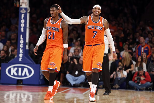 New York Knicks' Carmelo Anthony (7) reacts with Iman Shumpert (21) after the Knicks failed to score on a possession against the Atlanta Hawks during the second half of an NBA basketball game Saturday, Nov. 16, 2013, in New York.  Atlanta defeated New York 110-90. (AP Photo/Jason DeCrow)