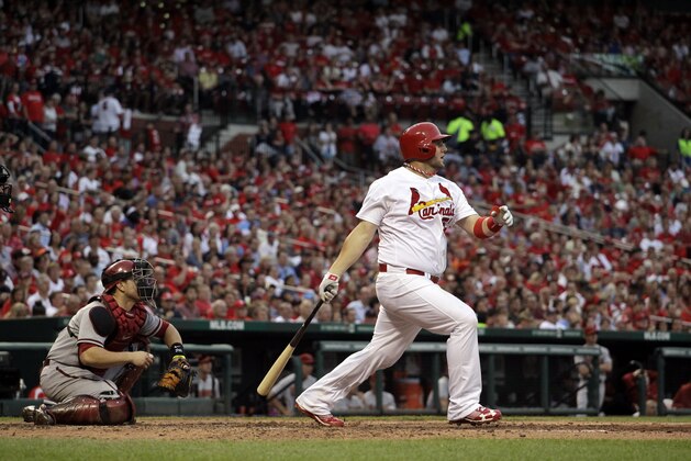 St. Louis Cardinals' Matt Adams, right, and Arizona Diamondbacks catcher Miguel Montero watch Adams' three-run home run during the fourth inning of a baseball game against the Arizona Diamondbacks Thursday, June 6, 2013, in St. Louis. (AP Photo/Jeff Roberson)