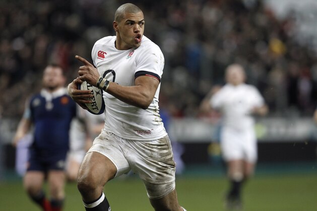 England's Luther Burrell runs to score a try, during his Six Nations rugby union international match against France, at the Stade de France, in Saint Denis, outside Paris, Saturday, Feb. 1, 2014. (AP Photo/Thibault Camus)
