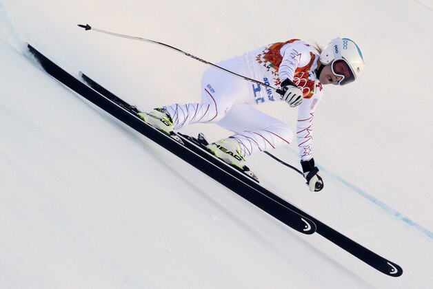United States' Julia Mancuso makes a turn in the women's downhill at the Sochi 2014 Winter Olympics, Wednesday, Feb. 12, 2014, in Krasnaya Polyana, Russia. (AP Photo/Charles Krupa)