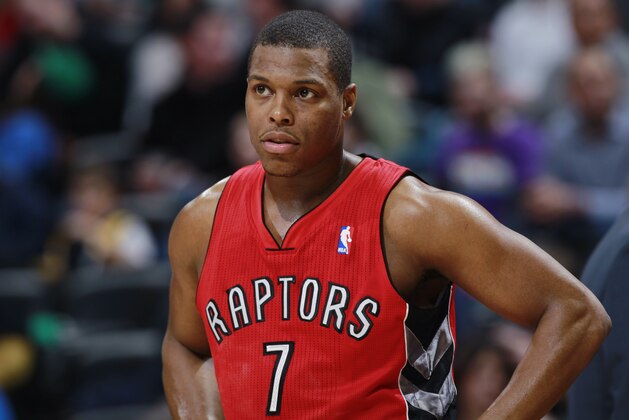 Toronto Raptors guard Kyle Lowry looks on against the Denver Nuggets in the third quarter of the Raptors' 100-90 victory in an NBA basketball game in Denver on Friday, Jan. 31, 2014. (AP Photo/David Zalubowski)