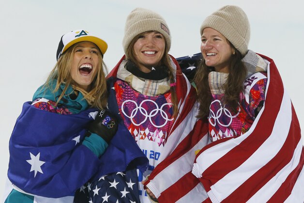 From left, silver medalist Australia's Torah Bright, gold medalist United States' Kaitlyn Farrington and bronze medalist United States' Kelly Clark pose following the women's snowboard halfpipe at the Rosa Khutor Extreme Park, at the 2014 Winter Olympics, Wednesday, Feb. 12, 2014, in Krasnaya Polyana, Russia. (AP Photo/Sergei Grits)