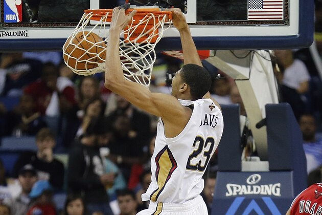 New Orleans Pelicans forward Anthony Davis (23) scores two of his 24 points against the Chicago Bulls, in the second half of an NBA basketball game in New Orleans, Saturday, Feb. 1, 2014. The Pelicans defeated the Bulls 88-79. (AP Photo/Bill Haber)