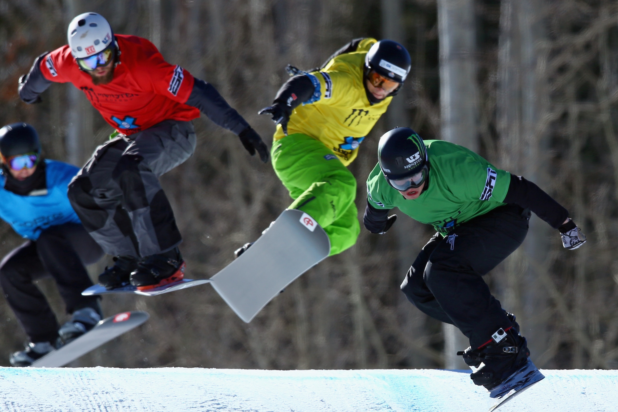 ASPEN, CO - JANUARY 24:  (R-L) Nate Holland of the United States races to first place in the finals of the men's Snowboarder X ahead of Konstantin Schad of Germany in third place and Alex Tuttle of the United States in second place during Winter X-Games 2014 Aspen at Buttermilk Mountain on January 24, 2014 in Aspen, Colorado.  (Photo by Doug Pensinger/Getty Images)