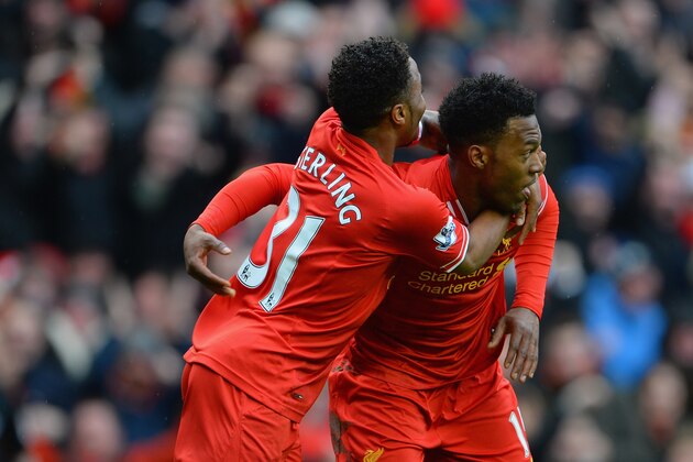 LIVERPOOL, ENGLAND - FEBRUARY 08:  Daniel Sturridge of Liverpool celebrates scoring the fourth goal with team-mate Raheem Sterling during the Barclays Premier League match between Liverpool and Arsenal at Anfield on February 8, 2014 in Liverpool, England.  (Photo by Michael Regan/Getty Images)