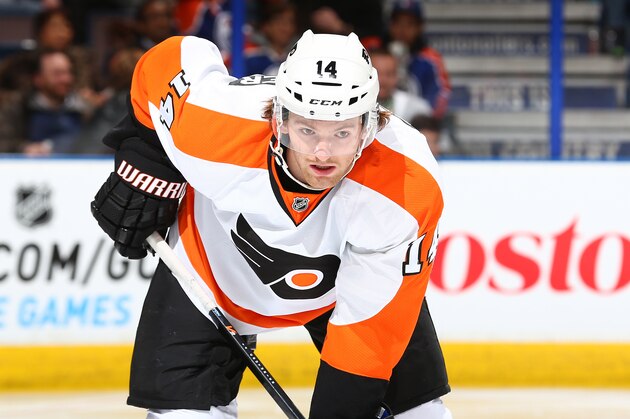 EDMONTON, AB - DECEMBER 28: Sean Couturier #14 of the Philadelphia Flyers lines up for a face off in a game against the Edmonton Oilers on December 28, 2013 at Rexall Place in Edmonton, Alberta, Canada. (Photo by Marko Ditkun/NHLI via Getty Images)