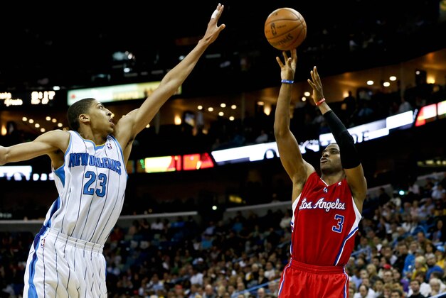 Mar 27, 2013; New Orleans, LA, USA; Los Angeles Clippers point guard Chris Paul (3) shoots over New Orleans Hornets power forward Anthony Davis (23) during the second half of a game at the New Orleans Arena. The Clippers defeated the Hornets 105-91. Mandatory Credit: Derick E. Hingle-USA TODAY Sports