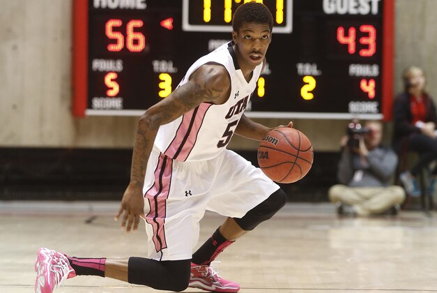 Utah guard Delon Wright (55) comes up with a loose ball against Washington State during the second half of an NCAA college basketball game in Salt Lake City, Saturday, Feb. 8, 2014. Utah won 81-63. (AP Photo/Jim Urquhart)