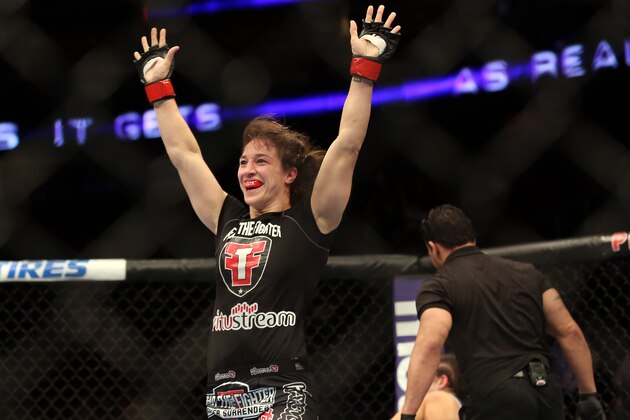 Sara McMann celebrates her win over Sheila Gaff after their UFC 159 Mixed Martial Arts bout in Newark, NJ, Saturday, April 27,2013.  McMann won via first round TKO. (AP Photo/Gregory Payan)