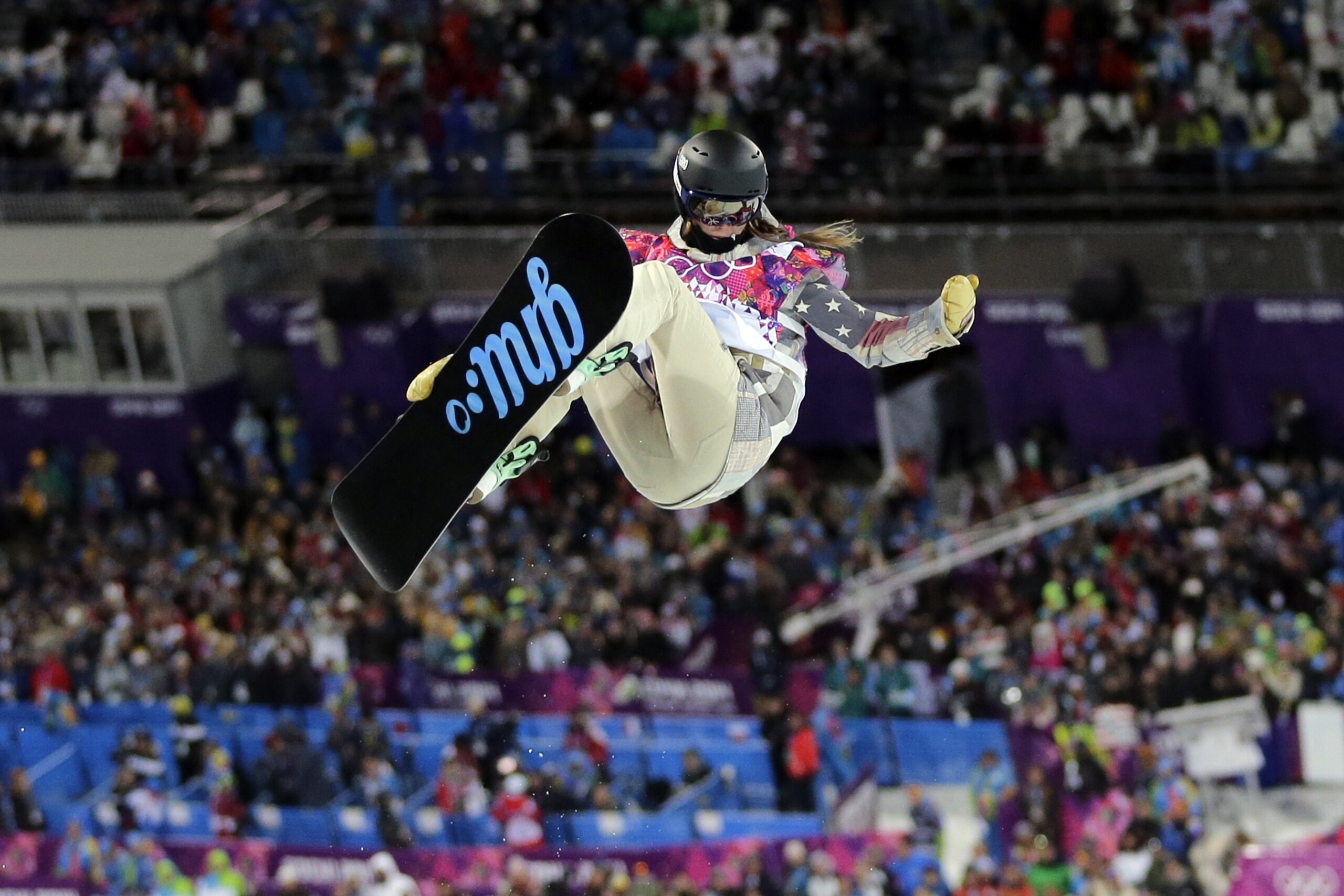 United States' Kaitlyn Farrington competes to win the gold medal in the women's snowboard halfpipe at the Rosa Khutor Extreme Park, at the 2014 Winter Olympics, Wednesday, Feb. 12, 2014, in Krasnaya Polyana, Russia. (AP Photo/Andy Wong)