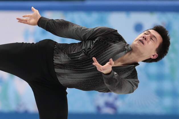 Patrick Chan of Canada competes in the men's team short program figure skating competition at the Iceberg Skating Palace during the 2014 Winter Olympics, Thursday, Feb. 6, 2014, in Sochi, Russia. (AP Photo/Ivan Sekretarev)