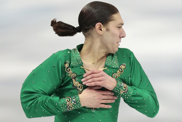 Jason Brown of the United States competes in the men's team free skate figure skating competition at the Iceberg Skating Palace during the 2014 Winter Olympics, Sunday, Feb. 9, 2014, in Sochi, Russia. (AP Photo/Ivan Sekretarev)