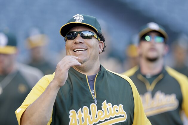 Oakland Athletics starting pitcher Bartolo Colon warms up before a baseball game against the Los Angeles Angels in Anaheim, Calif., Monday, Sept. 23, 2013. (AP Photo/Chris Carlson)
