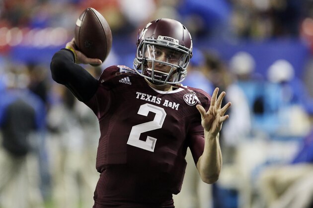 Texas A&M quarterback Johnny Manziel (2) warms up before the start of the Chick-fil-A Bowl NCAA college football game against Duke Tuesday, Dec. 31, 2013, in Atlanta. (AP Photo/John Bazemore)
