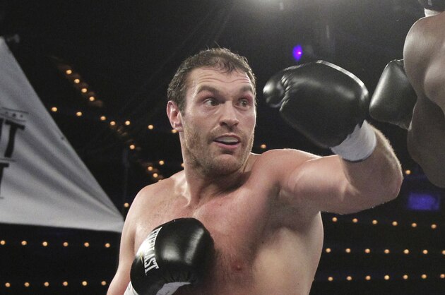 Tyson Fury is seen in the ring during a  heavyweight boxing match against Steve Cunningham, Saturday, April 20, 2013 at the Theatre at Madison Square Garden in New York. Fury defeated Cunningham in a seventh round knock out. (AP Photo/Mary Altaffer)