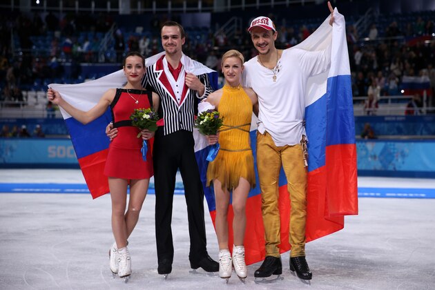 SOCHI, RUSSIA - FEBRUARY 12:  (L-R) Silver medalists Ksenia Stolbova and Fedor Klimov of Russia, gold medalists Tatiana Volosozhar and Maxim Trankov of Russia pose during the flower ceremony for the Figure Skating Pairs event during day five of the 2014 Sochi Olympics at Iceberg Skating Palace on February 12, 2014 in Sochi, Russia.  (Photo by Matthew Stockman/Getty Images)