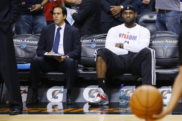 Miami Heat's LeBron James, right, sits on the bench next to head coach Erik Spoelstra prior to an NBA basketball game against the Phoenix Suns Tuesday, Feb. 11, 2014, in Phoenix. The Heat defeated the Suns 103-97. (AP Photo/Ross D. Franklin) Miami Heat's LeBron James, right, sits on the bench next to head coach Erik Spoelstra prior to an NBA basketball game against the Phoenix Suns Tuesday, Feb. 11, 2014, in Phoenix. The Heat defeated the Suns 103-97. (AP Photo/Ross D. Franklin)