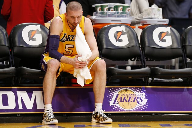 Los Angeles Lakers' Steve Blake sits along on the bench with a towel in his mouth after the Lakers lost to the Utah Jazz 96-79 in an NBA basketball game in Los Angeles, Tuesday, Feb. 11, 2014. (AP Photo/Danny Moloshok)