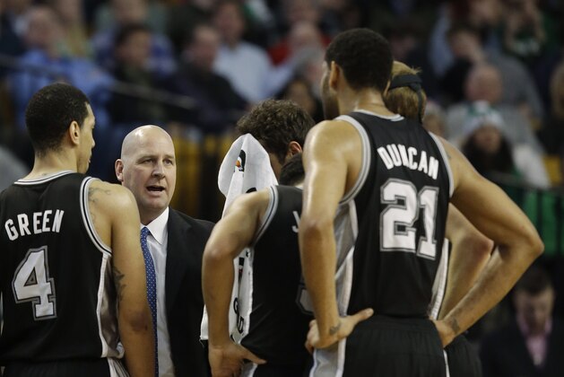 San Antonio Spurs head coach Gregg Popovich talks to his team during a time out during the second half of their NBA basketball game against the Boston Celtics in Boston, Wednesday, Feb. 12, 2014. The Spurs defeated the Celtics 104-92.(AP Photo/Stephan Savoia)