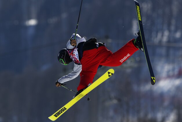 Joss Christensen of the United States takes a jump during a ski slopestyle training session at the Rosa Khutor Extreme Park, prior to the 2014 Winter Olympics, Wednesday, Feb. 5, 2014, in Krasnaya Polyana, Russia. (AP Photo/Sergei Grits)