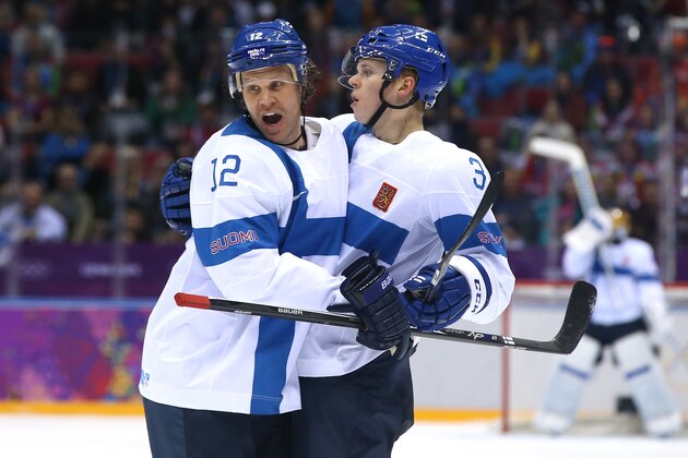 SOCHI, RUSSIA - FEBRUARY 13:  Olli Maatta #3 of Finland celebrates with teammate Olli Jokinen #12 after scoring a goal in the first period against Bernhard Starkbaum #29 of Austria during the Men's Ice Hockey Preliminary Round Group B game on day six of the Sochi 2014 Winter Olympics at Bolshoy Ice Dome on February 13, 2014 in Sochi, Russia.  (Photo by Bruce Bennett/Getty Images)