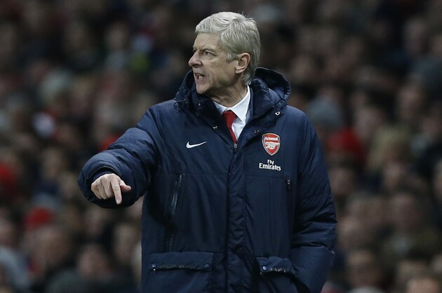 Arsenal's manager Arsene Wenger calls out to his players as he watches his team play against Crystal Palace during their English Premier League soccer match at Emirates Stadium in London, Sunday, Feb. 2, 2014. (AP Photo/Sang Tan)