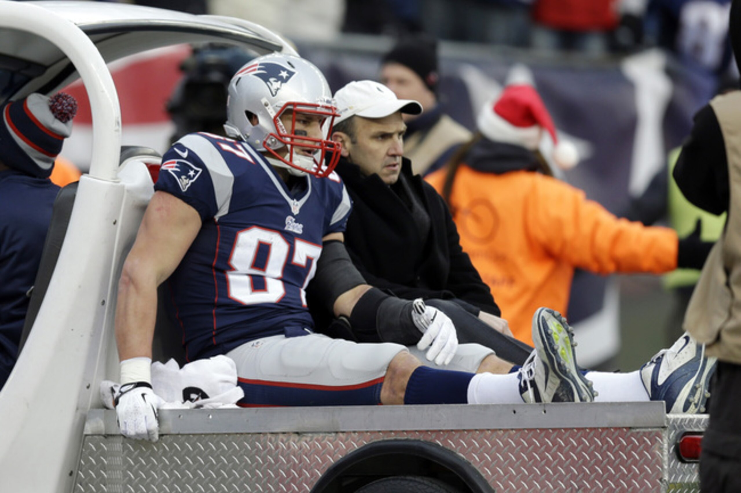 FILE - In this Sunday, Dec. 8, 2013, file photo, New England Patriots tight end Rob Gronkowski is carted off the field after getting injured in the third quarter of an NFL football game against the Cleveland Browns in Foxborough, Mass. Gronkowski's season ended abruptly Sunday with a knee injury when he took a low hit from Cleveland Browns safety T.J. Ward. No penalty was called.  (AP Photo/Steven Senne, File)