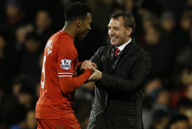 Liverpool's manager Brendan Rodgers, right, and Daniel Sturridge celebrate their win against Fulham at the end of their English Premier League soccer match at Craven Cottage, London, Wednesday, Feb. 12, 2014. (AP Photo/Sang Tan)