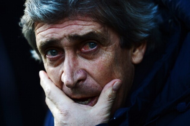 NORWICH, ENGLAND - FEBRUARY 08:  Manchester City manager Manuel Pellegrini looks on before the Barclays Premier League match between Norwich City and Manchester City at Carrow Road on February 8, 2014 in Norwich, England.  (Photo by Jamie McDonald/Getty Images)