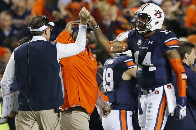 AUBURN, AL - NOVEMBER 30:  Nick Marshall #14 celebrates with head coach Gus Malzahn of the Auburn Tigers in the fourth quarter against the Alabama Crimson Tide at Jordan-Hare Stadium on November 30, 2013 in Auburn, Alabama.  (Photo by Kevin C. Cox/Getty Images)