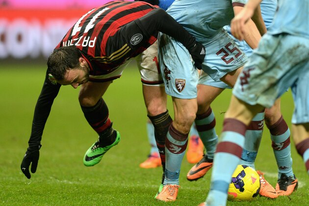 MILAN, ITALY - FEBRUARY 01:  Giampaolo Pazzini of AC Milan and Kamil Jacek Glik of Torino FC #25 compete for the ball during the Serie A match between AC Milan and Torino FC at San Siro Stadium on February 1, 2014 in Milan, Italy.  (Photo by Claudio Villa/Getty Images)