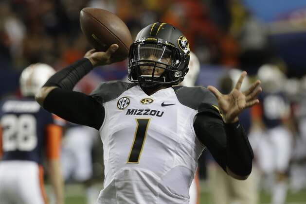 Missouri quarterback James Franklin (1) works out before the first half of the Southeastern Conference NCAA football championship game against Auburn, Saturday, Dec. 7, 2013, in Atlanta. (AP Photo/John Bazemore)