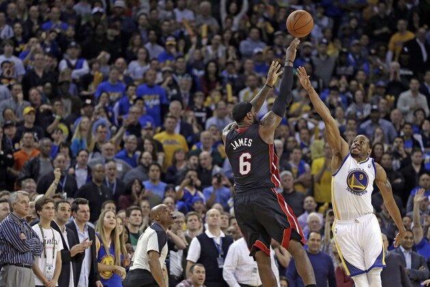 Miami Heat's LeBron James (6) shoots the game winning basket over Golden State Warriors' Andre Iguodala (9) during the second half of an NBA basketball game Wednesday, Feb. 12, 2014, in Oakland, Calif. (AP Photo/Ben Margot) Miami Heat's LeBron James (6) shoots the game winning basket over Golden State Warriors' Andre Iguodala (9) during the second half of an NBA basketball game Wednesday, Feb. 12, 2014, in Oakland, Calif. (AP Photo/Ben Margot)