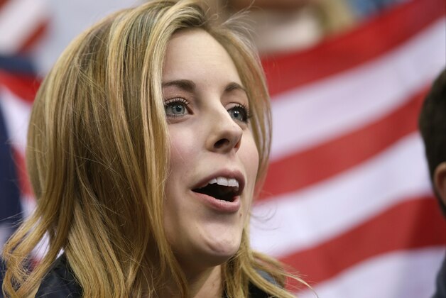 Ashley Wagner of the United States watches Jason Brown of the United States competes in the men's team free skate figure skating competition at the Iceberg Skating Palace during the 2014 Winter Olympics, Sunday, Feb. 9, 2014, in Sochi, Russia. (AP Photo/Darron Cummings, Pool)