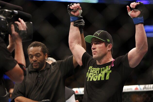 Chael Sonnen, right, is declared the victor after his match against Mauricio 'Shogun' Rua, of Brazil, in their UFC on Fox Sports 1 mixed martial arts light heavyweight bout in Boston, Saturday, Aug. 17,2013.  Sonnen won via first-round tapout via guillotine choke. (AP Photo/Gregory Payan)