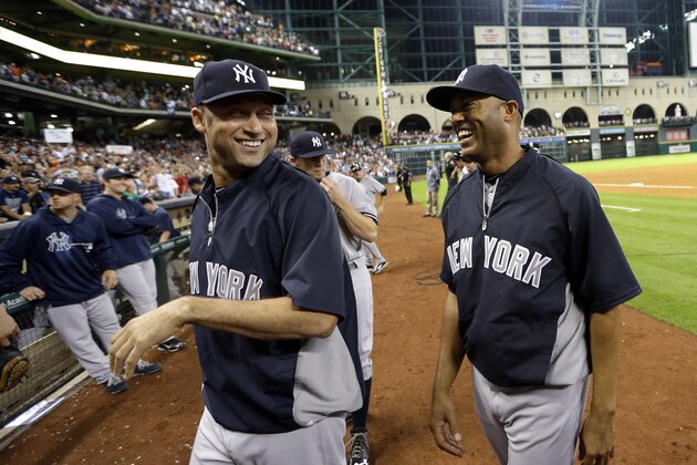 New York Yankees' Derek Jeter, left, and Mariano Rivera leave the field after a baseball game against the Houston Astros Saturday, Sept. 28, 2013, in Houston. (AP Photo/David J. Phillip)