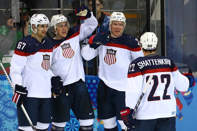 SOCHI, RUSSIA - FEBRUARY 13:  Paul Stastny #26 of United States celebrates with team-mates after scoring a goal against Jaroslav Halak #41 of Slovakia in the second period during the Men's Ice Hockey Preliminary Round Group A game on day six of the Sochi 2014 Winter Olympics at Shayba Arena on February 13, 2014 in Sochi, Russia.  (Photo by Streeter Lecka/Getty Images)