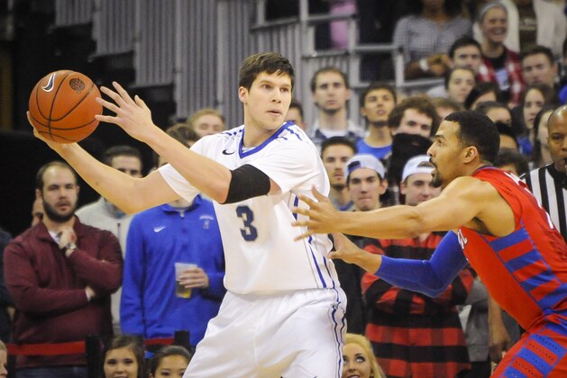 Feb 7, 2014; Omaha, NE, USA; Creighton Bluejays forward Doug McDermott (3) looks to pass around DePaul Blue Demons forward DeJuan Marrero (1)during their NCAA mens basketball game against the DePaul Blue Demons at CenturyLink Center. Mandatory Credit: Dave Weaver-USA TODAY Sports