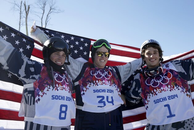 Men's ski slopestyle medalists from the United States Gus Kenworthy, left, silver, Joss Christensen, center, gold, and Nicholas Goepper, bronze, right, pose for photographers at the Rosa Khutor Extreme Park, at the 2014 Winter Olympics, Thursday, Feb. 13, 2014, in Krasnaya Polyana, Russia.(AP Photo/Gero Breloer)