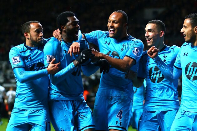 NEWCASTLE UPON TYNE, ENGLAND - FEBRUARY 12:  Emmanuel Adebayor of Tottenham Hotspur (2r) celebrates scoring their third goal with team mate sduring the Barclays Premier League match between  Newcastle United and Tottenham Hotspur at St James' Park on February 12, 2014 in Newcastle upon Tyne, England.  (Photo by Michael Steele/Getty Images)