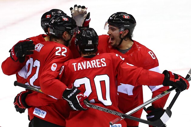 SOCHI, RUSSIA - FEBRUARY 13:  Jamie Benn #22 of Canada celebrates with his teammates after scoring a goal in the second period against Lars Haugen #30 of Norway during the Men's Ice Hockey Preliminary Round Group B game on day six of the Sochi 2014 Winter Olympics at Bolshoy Ice Dome on February 13, 2014 in Sochi, Russia.  (Photo by Streeter Lecka/Getty Images)
