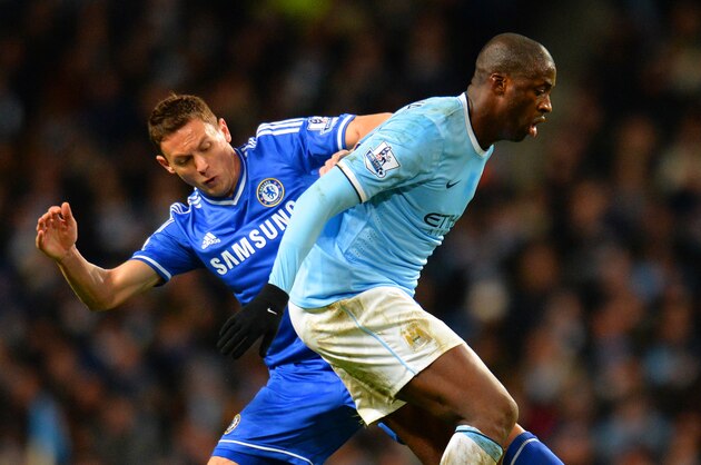 MANCHESTER, ENGLAND - FEBRUARY 03:  Nemanja Matic of Chelsea tackles Yaya Toure of Manchester City during the Barclays Premier League match between Manchester City and Chelsea at Etihad Stadium on February 3, 2014 in Manchester, England.  (Photo by Shaun Botterill/Getty Images)