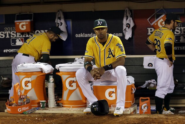 Oakland Athletics center fielder Chris Young sits on a gatorade cooler after the Oakland Athletics lost 3-0 to the Detroit Tigers in Game 5 of an American League baseball division series in Oakland, Calif., Thursday, Oct. 10, 2013. (AP Photo/Marcio Jose Sanchez)
