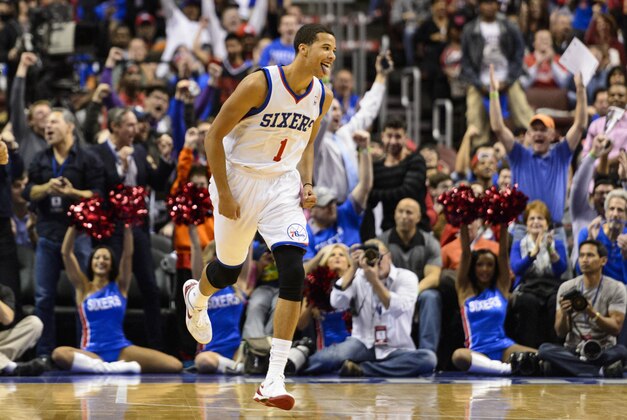 Oct 30, 2013; Philadelphia, PA, USA; Philadelphia 76ers guard Michael Carter-Williams (1) celebrates making a basket during the first quarter against the Miami Heat at Wells Fargo Center. The Sixers defeated the Heat 114-110. Mandatory Credit: Howard Smith-USA TODAY Sports