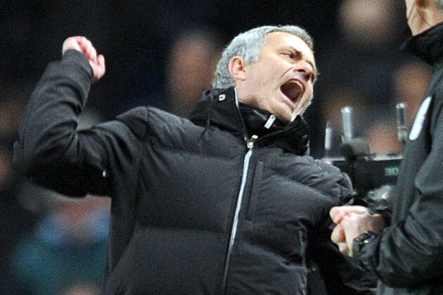 Chelsea's manager Jose Mourinho, left, celebrates victory at the end of the game during their English Premier League soccer match against Manchester City at the Etihad stadium in Manchester, England, Monday Feb. 3, 2014. (AP Photo/Clint Hughes)