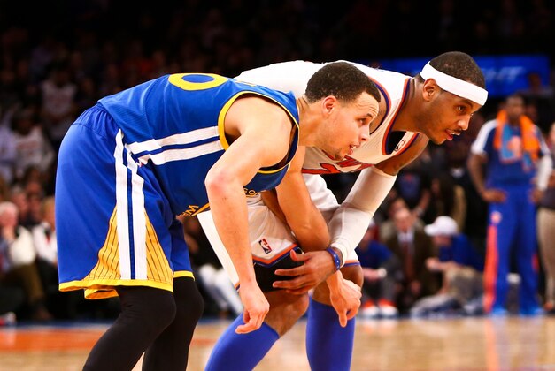 Feb. 27, 2013; New York, NY, USA; New York Knicks small forward Carmelo Anthony (7) and Golden State Warriors point guard Stephen Curry (30) on the court during the fourth quarter at Madison Square Garden. Knicks won 109-105. Mandatory Credit: Debby Wong-USA TODAY Sports