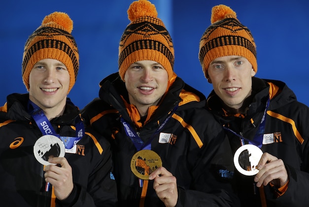 Men’s 5,000-meter speedskating medalists from the Netherlands, from left, Jan Blokhuijsen, silver, Sven Kramer, gold, and Jorrit Bergsma, bronze, pose during their medals ceremony at the 2014 Winter Olympics, Sunday, Feb. 9, 2014, in Sochi, Russia. (AP Photo/Morry Gash)